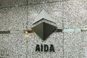 AIDA ENGINEERING signage and logo